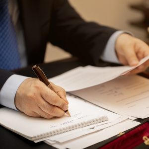 Businessman signing important contract papers. High quality photo